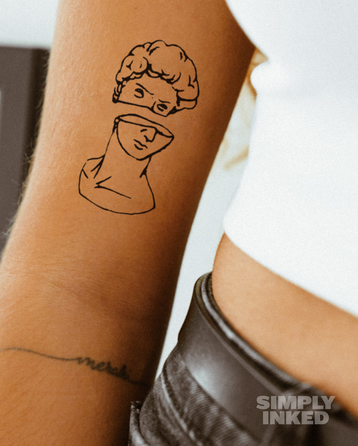 Mid evil Statue Tattoo